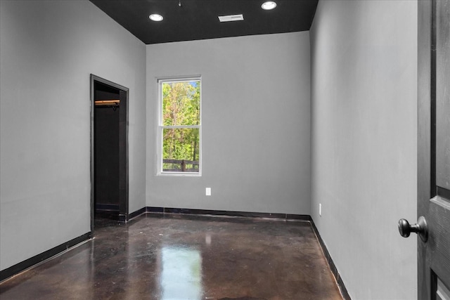 8360 Pinewood Rd, Lyles, TN 37098 - unfurnished room with baseboards, recessed lighting, finished concrete floors, and visible vents