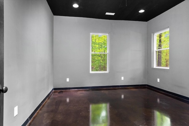 8360 Pinewood Rd, Lyles, TN 37098 - spare room with recessed lighting, baseboards, and concrete floors