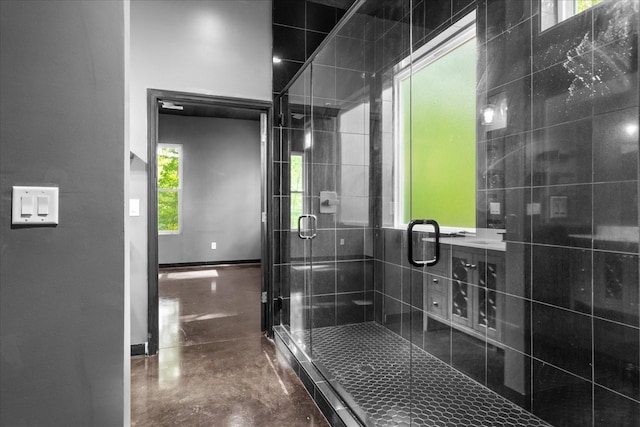 8360 Pinewood Rd, Lyles, TN 37098 - bathroom featuring baseboards, a shower stall, and finished concrete flooring