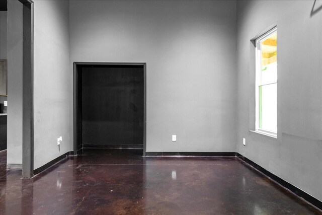 8360 Pinewood Rd, Lyles, TN 37098 - unfurnished room with baseboards and concrete flooring