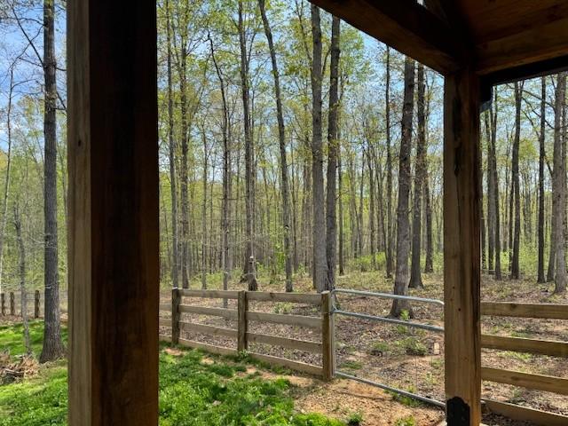 8360 Pinewood Rd, Lyles, TN 37098 - exterior space featuring fence and a wooded view