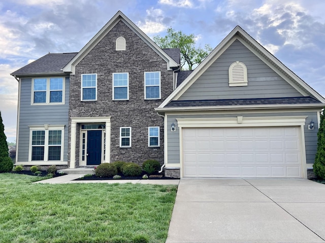 820 Turnbo Dr, Gallatin, TN 37066 - colonial-style house featuring an attached garage, a front yard, driveway, and stone siding