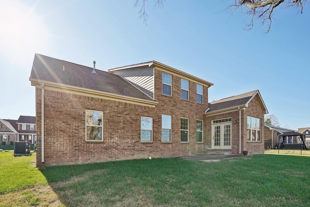 820 Turnbo Dr, Gallatin, TN 37066 - rear view of property with a lawn, brick siding, central AC, and a patio area