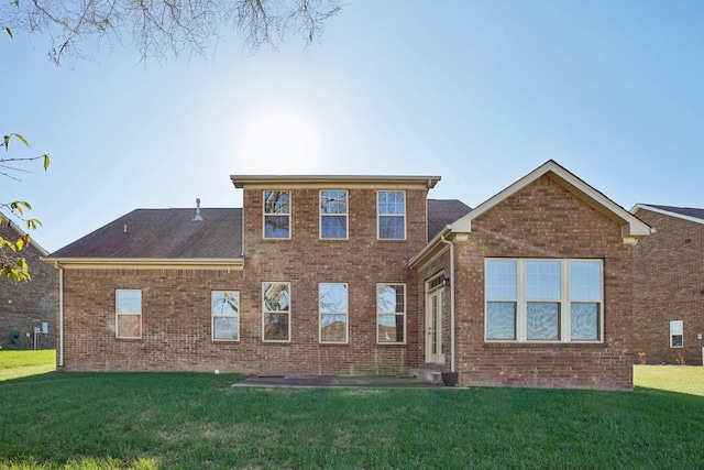 820 Turnbo Dr, Gallatin, TN 37066 - back of house featuring a yard and brick siding