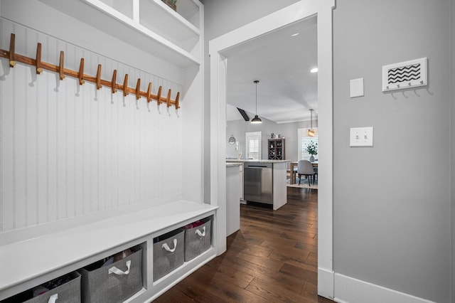 mudroom with dark wood-style flooring