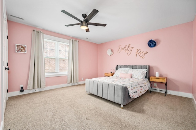bedroom with carpet floors, baseboards, and visible vents