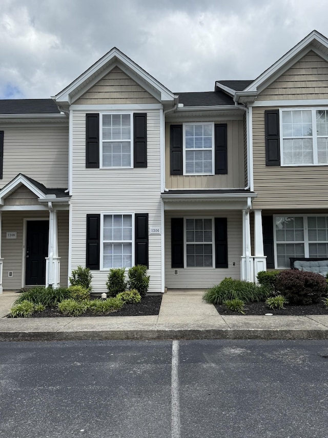 view of property featuring uncovered parking