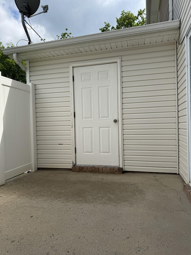 garage featuring a storage unit