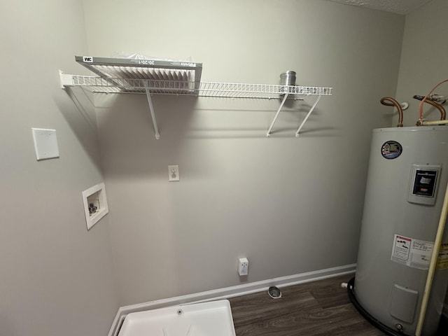 washroom with laundry area, washer hookup, baseboards, dark wood-type flooring, and electric water heater
