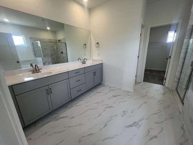 1603 Burlwood Ct, Murfreesboro, TN 37129 - bathroom featuring a stall shower, marble finish floors, a walk in closet, double vanity, and baseboards