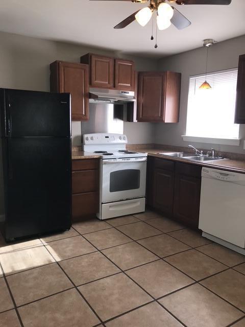 1727 N Concord Rd, Chattanooga, TN 37421 - kitchen with a ceiling fan, a sink, light tile patterned floors, under cabinet range hood, and white appliances