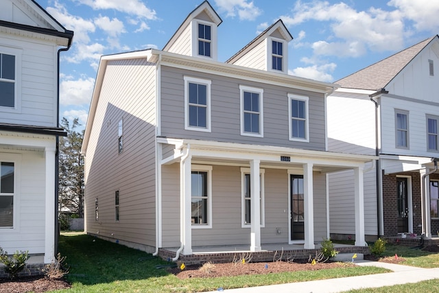 view of front of home featuring a porch and a front yard
