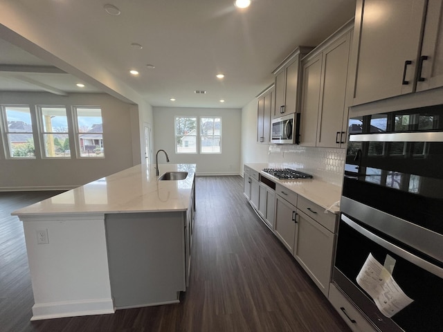 1611 Burlwood Ct, Murfreesboro, TN 37129 - kitchen with appliances with stainless steel finishes, a sink, dark wood finished floors, recessed lighting, and baseboards