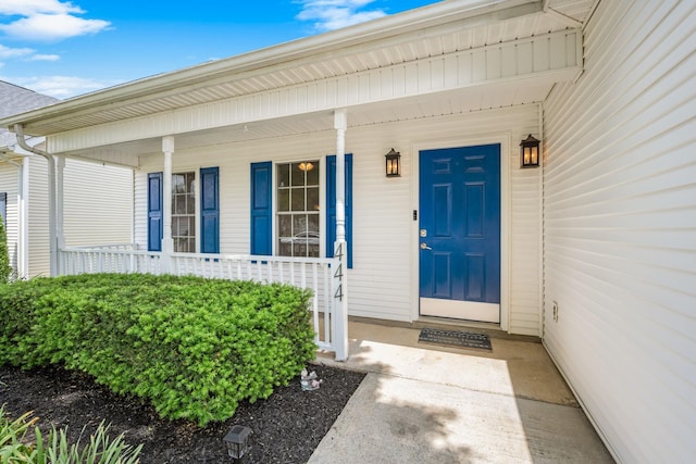 property entrance with covered porch