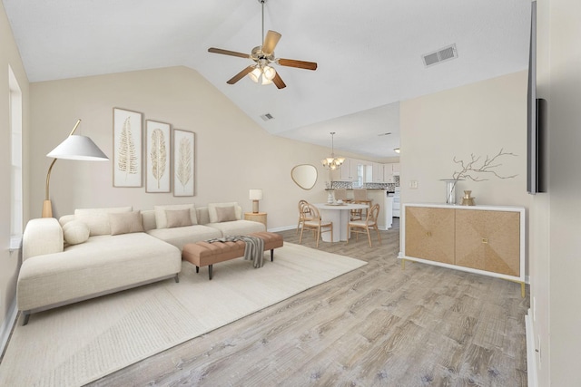 444 Drexel Ct, Murfreesboro, TN 37128 - living area with visible vents, light wood-style flooring, ceiling fan with notable chandelier, and vaulted ceiling