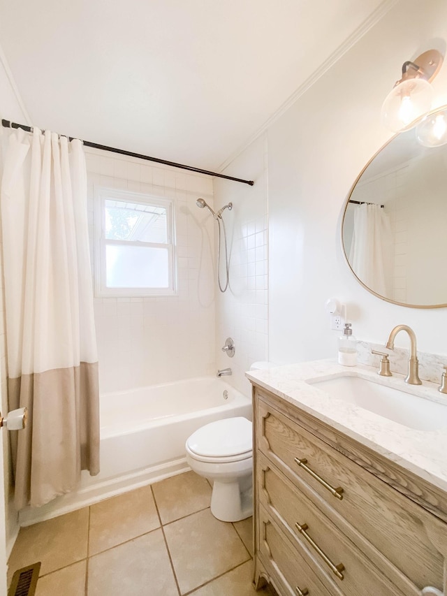 bathroom with visible vents, tile patterned flooring, shower / bath combo, vanity, and toilet