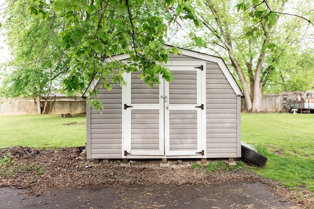 view of shed with fence