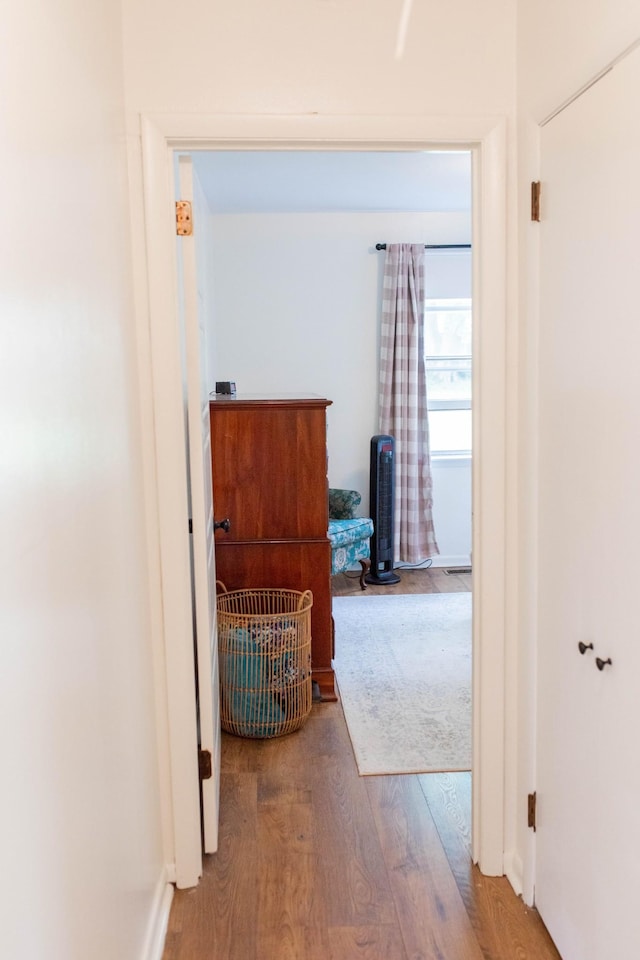 corridor featuring wood finished floors