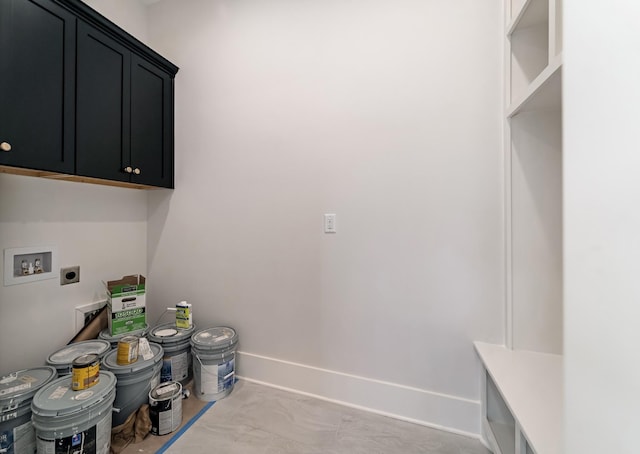 laundry room featuring baseboards, hookup for an electric dryer, washer hookup, and cabinet space