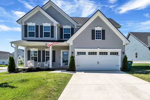 3012 Manchester Dr, Spring Hill, TN 37174 - view of front of home with covered porch, a garage, concrete driveway, and a front lawn