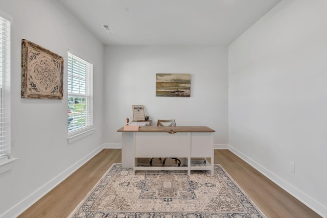 3012 Manchester Dr, Spring Hill, TN 37174 - home office featuring baseboards, wood finished floors, and visible vents