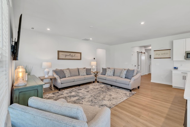 3012 Manchester Dr, Spring Hill, TN 37174 - living area featuring light wood-style floors, recessed lighting, a barn door, and visible vents