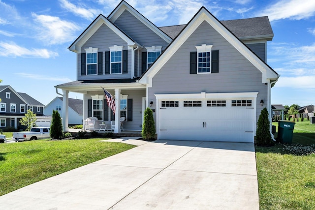 3012 Manchester Dr, Spring Hill, TN 37174 - view of front of house featuring covered porch, driveway, a front yard, and a garage