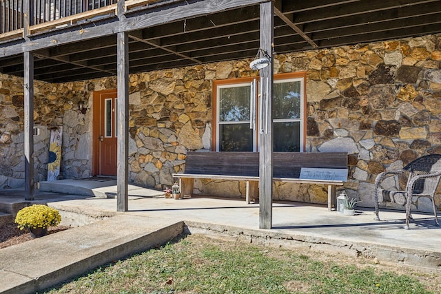 635 Cane Creek Rd, Hohenwald, TN 38462 - doorway to property with a wooden deck and stone siding