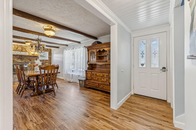 635 Cane Creek Rd, Hohenwald, TN 38462 - entryway featuring an inviting chandelier, baseboards, and light wood-style flooring