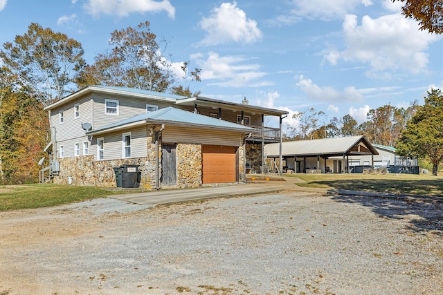 635 Cane Creek Rd, Hohenwald, TN 38462 - view of front facade with concrete driveway and stone siding