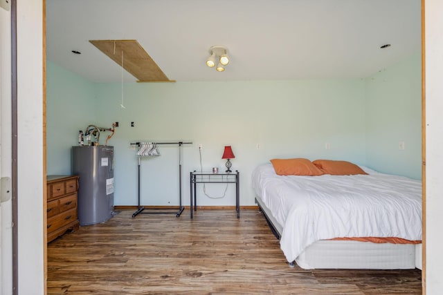 635 Cane Creek Rd, Hohenwald, TN 38462 - bedroom featuring wood finished floors and electric water heater