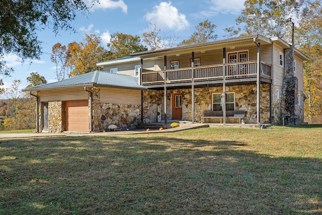 635 Cane Creek Rd, Hohenwald, TN 38462 - view of front of property with a garage, metal roof, stone siding, and a front lawn