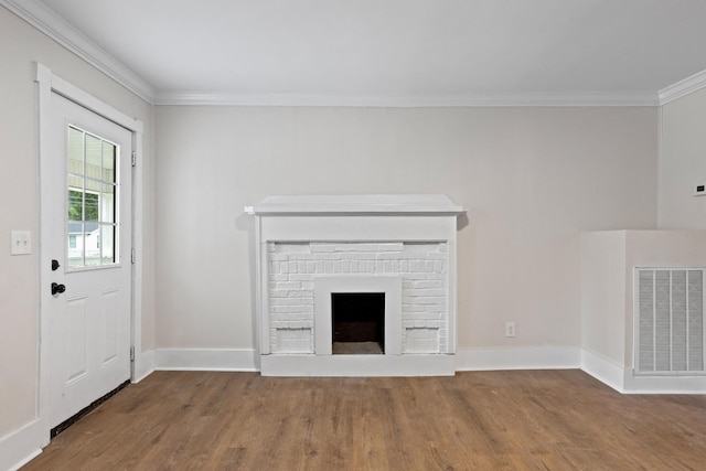 1903 S Orchard Knob Ave, Chattanooga, TN 37404 - unfurnished living room with crown molding, visible vents, wood finished floors, and a fireplace