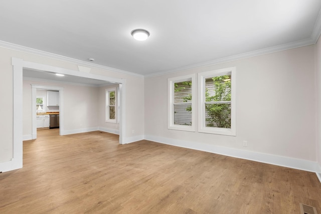 1903 S Orchard Knob Ave, Chattanooga, TN 37404 - unfurnished room with baseboards, ornamental molding, light wood-style floors, and a wealth of natural light