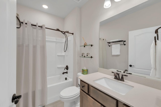 full bath featuring toilet, tile patterned flooring, shower / bath combo, and vanity