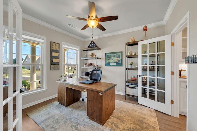 office space with visible vents, french doors, and light wood-style floors