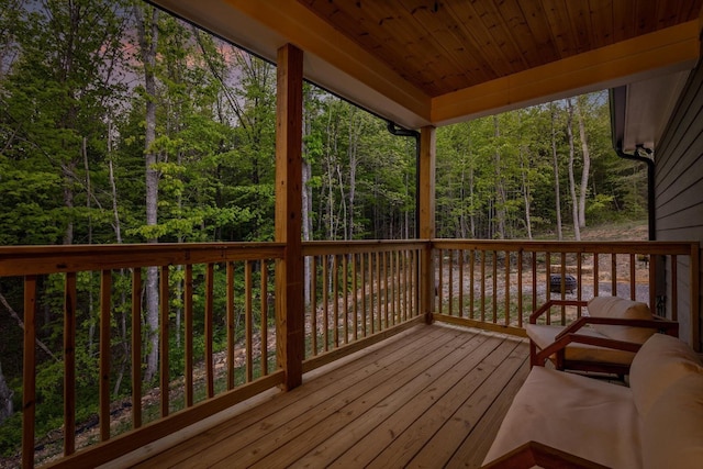 wooden terrace with a forest view