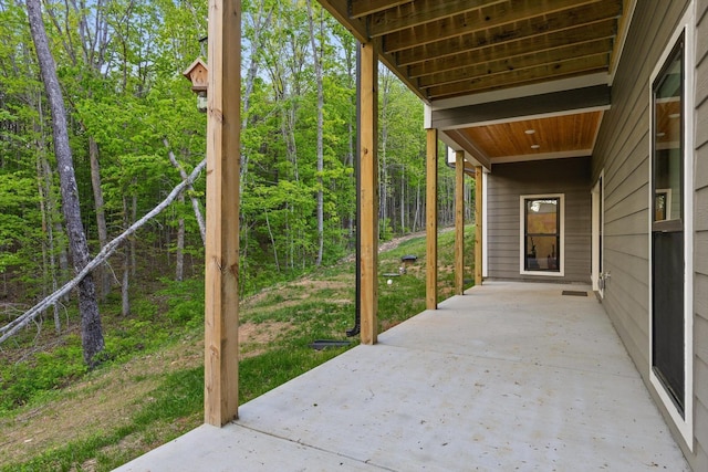 view of patio with a forest view