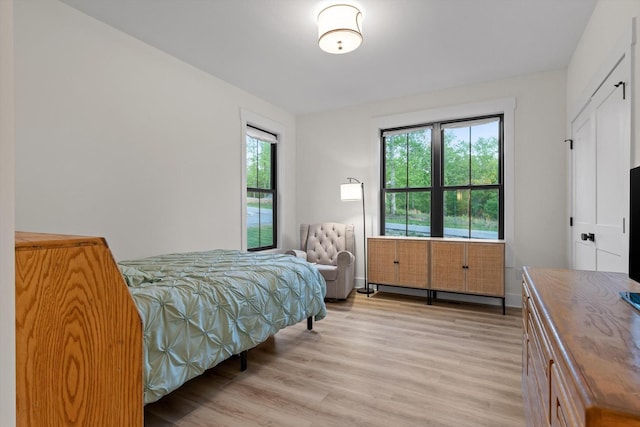 bedroom with light wood-style flooring