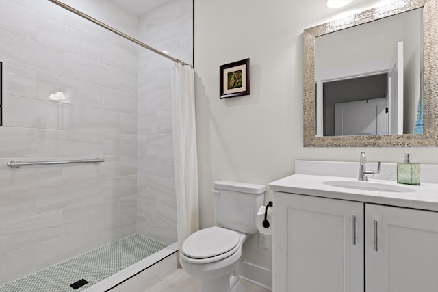 full bathroom with vanity, baseboards, a shower stall, and toilet