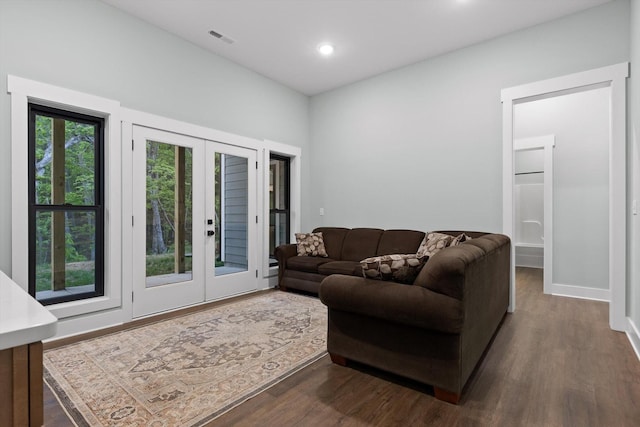 living area with visible vents, baseboards, recessed lighting, french doors, and dark wood finished floors