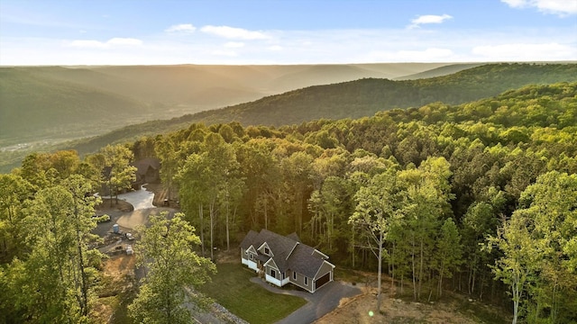 aerial view featuring a wooded view