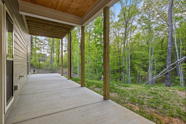 view of patio featuring a wooded view