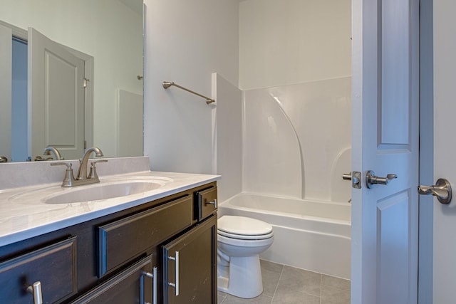 full bath featuring toilet, bathtub / shower combination, tile patterned flooring, and vanity