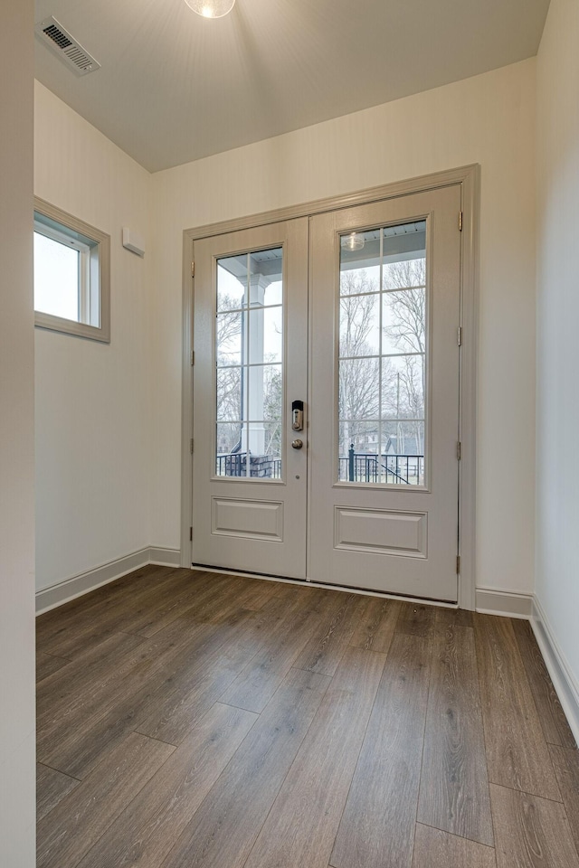 doorway to outside with visible vents, french doors, and wood finished floors