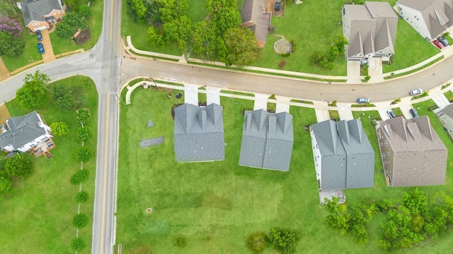 birds eye view of property with a residential view