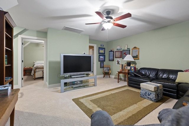 living area with carpet floors, a ceiling fan, baseboards, and visible vents