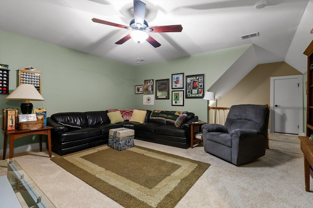 living area featuring carpet flooring, a ceiling fan, and visible vents