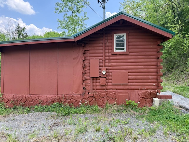 view of side of home featuring log siding
