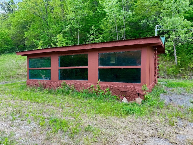 view of side of property with a view of trees and log exterior